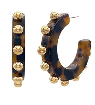 Tortoise resin hoop earrings with polished gold studs; modern statement jewelry.