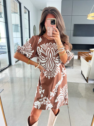 Brown printed short sleeve dress with relaxed fit and above-the-knee hemline