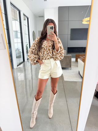 Leopard top in muted shades of brown and rose pink with metallic trim. 