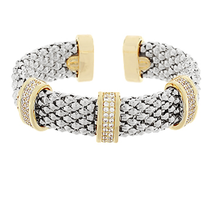 Silver mesh cuff bracelet with gold-tone bands and crystal pavé accents; bold statement jewelry.