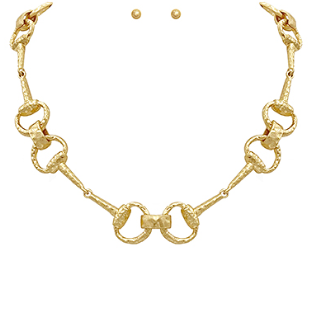 Gold horse bit necklace with interlocking equestrian links.
